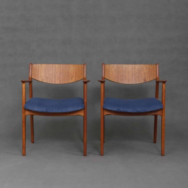 Two teak armchairs in blue corduroy