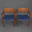 Two teak armchairs in blue corduroy