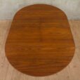 Hans Olsen style teak table with internal hide in plates   scaled