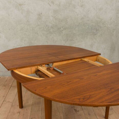 Hans Olsen style teak table with internal hide-in plates 1965-7 Hans Olsen style teak table with internal hide in plates scaled