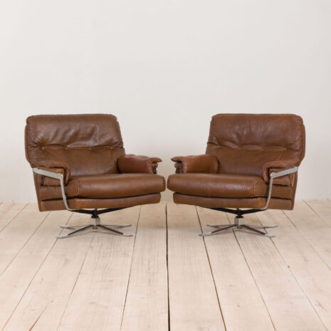 Pair of brown buffalo leather swivel lounge chairs by Aalborg Polstermobelfabrik