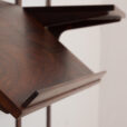 rosewood wall unit with a desk and display shelf mounted on veneered metal rails scaled