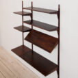 rosewood wall unit with a desk and display shelf mounted on veneered metal rails scaled