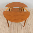 Mid century Danish Round teak extension table with hidden leaves s scaled