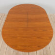 Mid century Danish Round teak extension table with hidden leaves s scaled