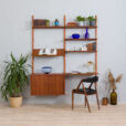 Danish two bay modular wall unit with a desk sliding doors cabinet and a display shelf in Sorensen Cadovius style s scaled