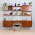 vintage three bay teak wall unit with a desk and cabinets and shelves scaled
