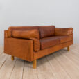 Danish two seater vintage cognac leather sofa in the style of Jorgen Gammelgaard  scaled