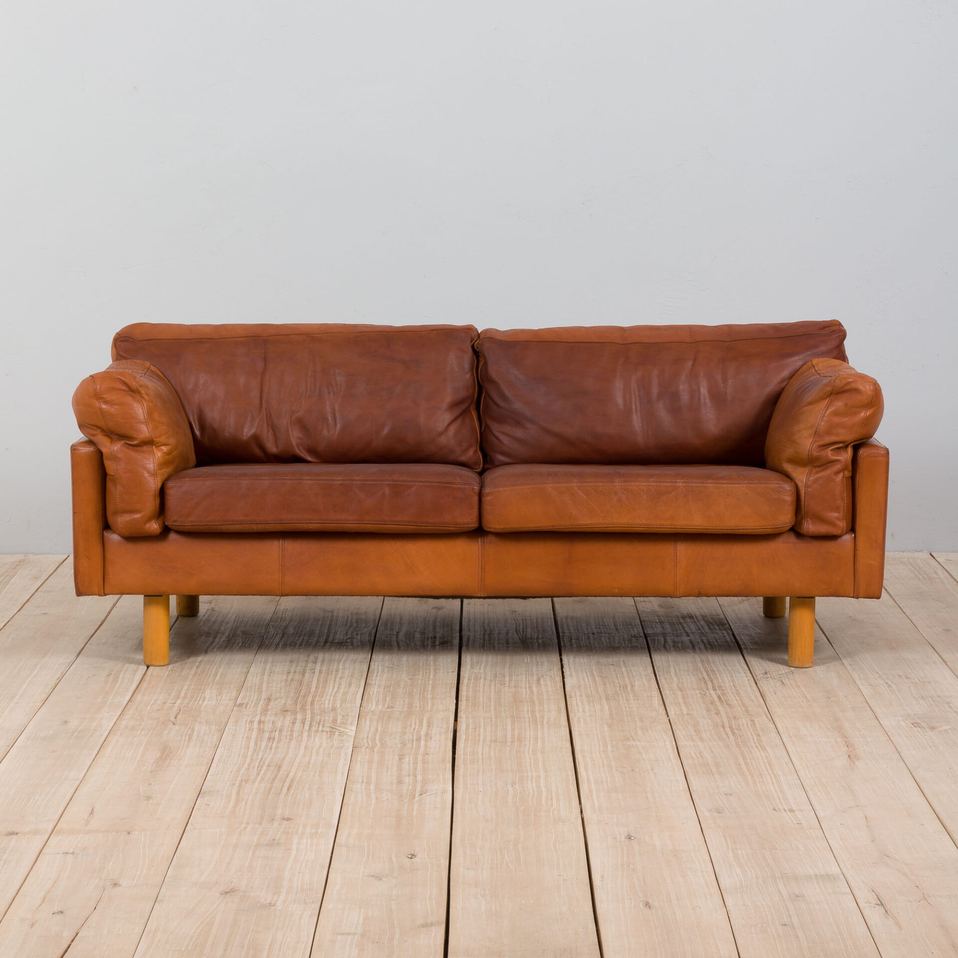 Danish two the half seater vintage cognac leather sofa in the style of Jørgen Gammelgaard, 1970s. - Futureantiques
