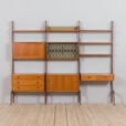 Free standing  bay teak ergo wall unit with a desk  cabinets and  shelves  scaled