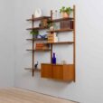 Danish teak wall unit with sliding door cabinet and  shelves in the style of Kurt Ostervig s