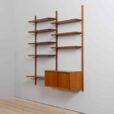 Danish teak wall unit with sliding door cabinet and  shelves in the style of Kurt Ostervig s
