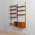 Danish teak wall unit with sliding door cabinet and  shelves in the style of Kurt Ostervig s