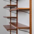 Danish teak wall unit with sliding door cabinet and  shelves in the style of Kurt Ostervig s