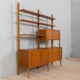 Scandinavian bay teak wall unit with a bar cabinet and brass details kleppen ingolf boben