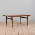 Rectangular teak dining table with hidden extension leaves by Johannes Andersen