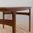 Rectangular teak dining table with hidden extension leaves by Johannes Andersen