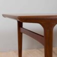 Rectangular teak dining table with hidden extension leaves by Johannes Andersen