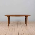 Rectangular teak dining table with hidden extension leaves by Johannes Andersen