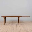 Rectangular teak dining table with hidden extension leaves by Johannes Andersen