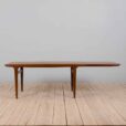 Rectangular teak dining table with hidden extension leaves by Johannes Andersen