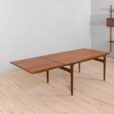Rectangular teak dining table with hidden extension leaves by Johannes Andersen