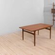 Rectangular teak dining table with hidden extension leaves by Johannes Andersen