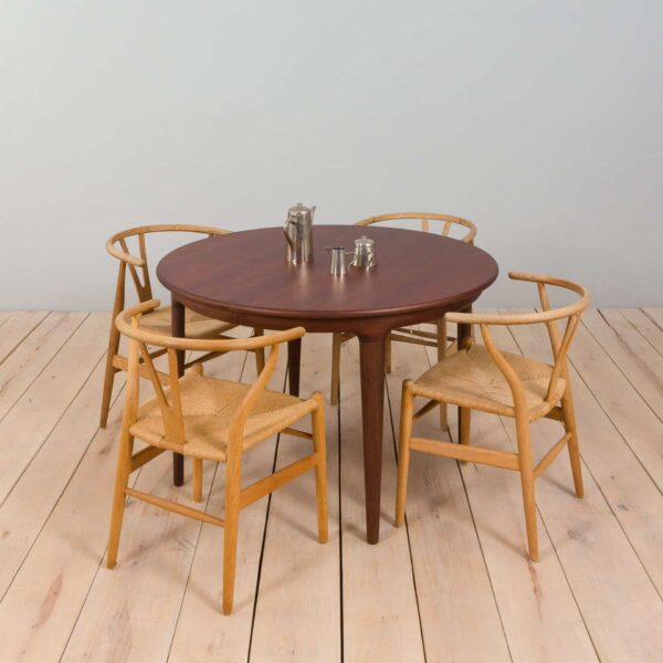 Mid century lacquered rosewood round dining table with  extension leaves with aprons Denmark s