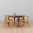 Mid century lacquered rosewood round dining table with  extension leaves with aprons Denmark s