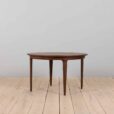 Mid century lacquered rosewood round dining table with  extension leaves with aprons Denmark s