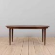 Mid century lacquered rosewood round dining table with  extension leaves with aprons Denmark s