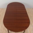Mid century lacquered rosewood round dining table with  extension leaves with aprons Denmark s