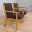 Pair of oak GE Hans Wegner easy lounge chairs in original upholstery Denmark s