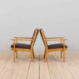 Pair of oak GE Hans Wegner easy lounge chairs in original upholstery Denmark s