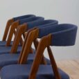 Set of reupholstered mid century Danish teak dining chairs by Th