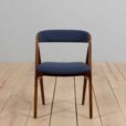 Set of reupholstered mid century Danish teak dining chairs by Th