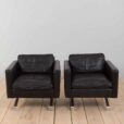 a pair of leather armchairs