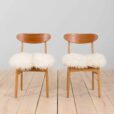 Pair of oak dining chairs in the style of Hans Wegner in long hair sheepskin Denmark s