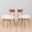 Pair of oak dining chairs in the style of Hans Wegner in long hair sheepskin Denmark s
