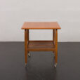 23274 Duński stolik boczny z drewna tekowego na podstawkach, lata 60.