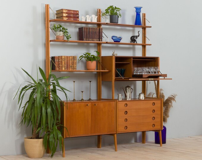 Scandinavian free standing teak wall unit with a bar cabinet and brass details, 1970s