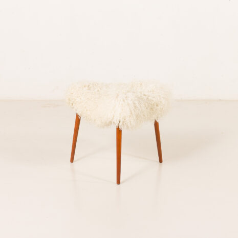 Scandinavian-mid-century-triangular-footstool-in-long-hair-sheepskin-Denmark-1960s
