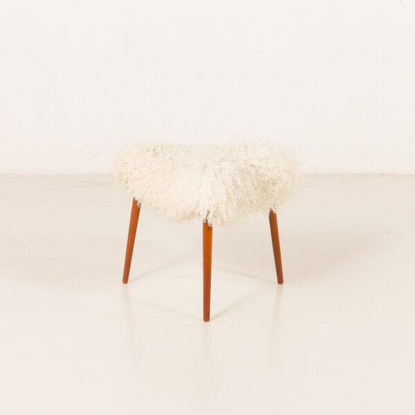 Scandinavian-mid-century-triangular-footstool-in-long-hair-sheepskin-Denmark-1960s